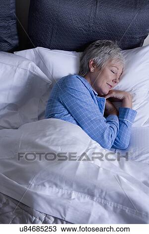 High angle view of mature woman sleeping View Large Photo Image Stock Image - High angle view of mature woman sleeping. Fotosearch