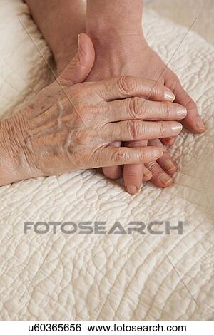 Holding hands View Large Photo Image Stock Photograph - Holding hands. Fotosearch