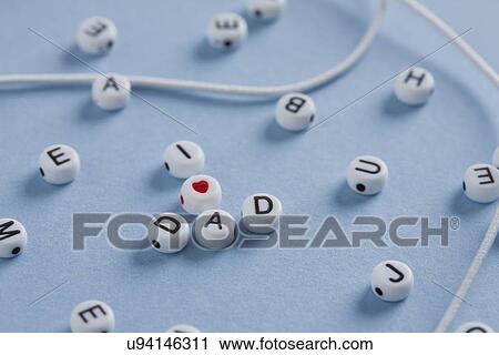 Stock Image - I love dad beads, studio shot. Fotosearch
