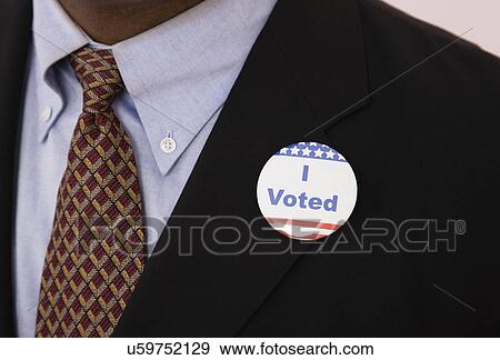"I voted" badge on man's suit View Large Photo Image Stock Photo - "I voted" badge on man's suit. Fotosearch