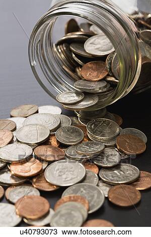 Stock Image - Jar with coins. Fotosearch