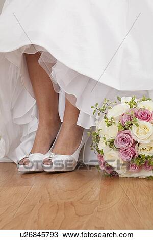 Stock Image - Low section of bride. Fotosearch