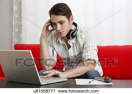Male musician composing using laptop View Large Photo Image Stock Image - Male musician composing using laptop. Fotosearch