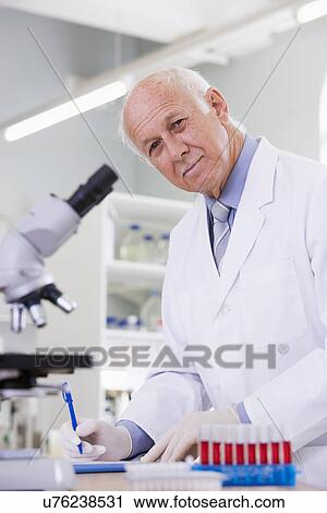 Male scientist doing research in laboratory, portrait View Large Photo Image Stock Image - Male scientist doing research in laboratory, portrait. Fotosearch
