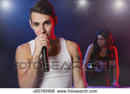 Male singer and female keyboarder on stage View Large Photo Image Stock Photo - Male singer and female keyboarder on stage. Fotosearch