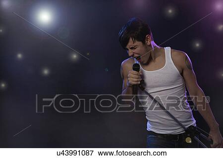 Male singer on stage View Large Photo Image Stock Photo - Male singer on stage. Fotosearch