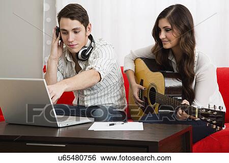 Man and woman composing View Large Photo Image Stock Photograph - Man and woman composing. Fotosearch