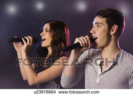 Man and woman singing on stage View Large Photo Image Picture - Man and woman singing on stage. Fotosearch