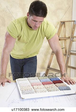 Man looking at carpet samples View Large Photo Image Stock Image - Man looking at carpet samples. Fotosearch