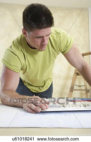 Man looking at carpet samples View Large Photo Image Stock Image - Man looking at carpet samples. Fotosearch