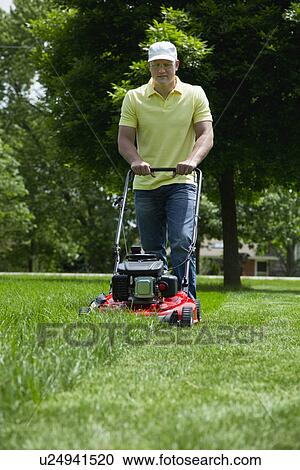 Man mowing lawn View Large Photo Image Stock Image - Man mowing lawn. Fotosearch