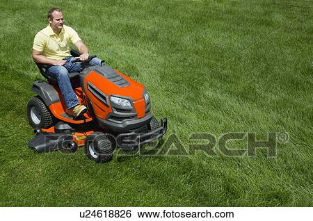Man mowing lawn View Large Photo Image Stock Photograph - Man mowing lawn. Fotosearch