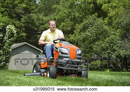 Man mowing lawn View Large Photo Image Stock Photography - Man mowing lawn. Fotosearch