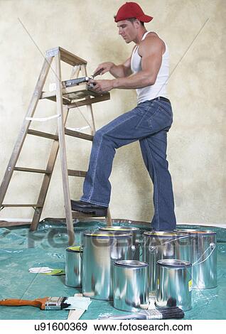Man painting room View Large Photo Image Stock Photo - Man painting room. Fotosearch
