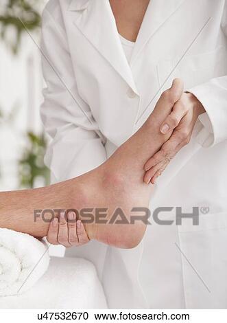 Stock Image - Man receiving massage, close-up. Fotosearch
