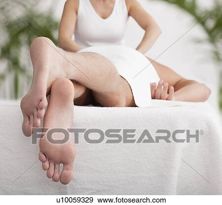 Stock Photo - Man receiving massage, close-up. Fotosearch