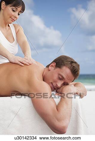 Man receiving massage View Large Photo Image Picture - Man receiving massage. Fotosearch