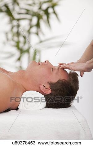 Stock Image - Man receiving massage. Fotosearch