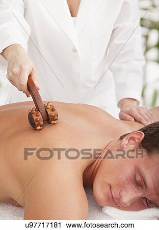 Stock Image - Man receiving massage. Fotosearch