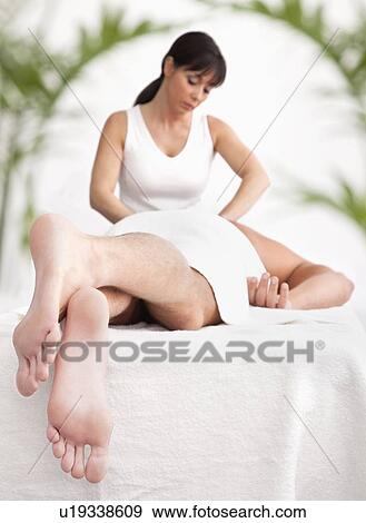 Man receiving massage View Large Photo Image Stock Photo - Man receiving massage. Fotosearch