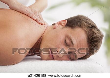 Man receiving massage View Large Photo Image Stock Photo - Man receiving massage. Fotosearch