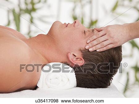 Man receiving massage View Large Photo Image Stock Photo - Man receiving massage. Fotosearch