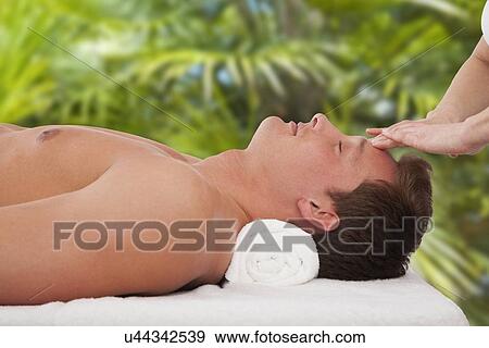 Man receiving massage View Large Photo Image Stock Photo - Man receiving massage. Fotosearch