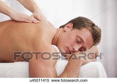 Man receiving massage View Large Photo Image Stock Photography - Man receiving massage. Fotosearch