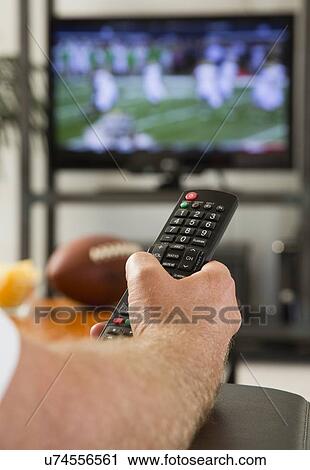 Man watching tv View Large Photo Image Stock Image - Man watching tv. Fotosearch
