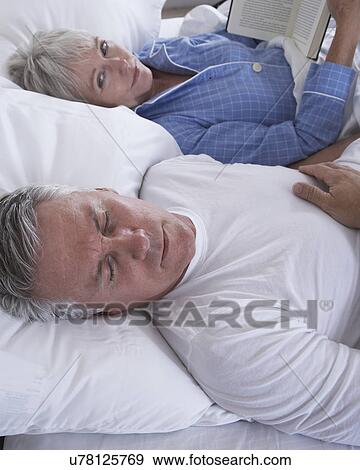 Mature couple in bed View Large Photo Image Stock Photo - Mature couple in bed. Fotosearch