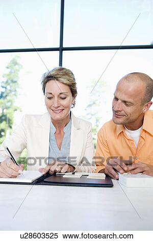 Mature man and interior designer choosing tile sample, smiling View Large Photo Image Stock Photography - Mature man and interior designer choosing tile sample, smiling. Fotosearch
