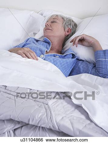 Mature woman sleeping View Large Photo Image Stock Photograph - Mature woman sleeping. Fotosearch