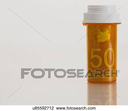 Medicine bottle wrapped in Canadian 50 dollar bill View Large Photo Image Stock Image - Medicine bottle wrapped in Canadian 50 dollar bill. Fotosearch