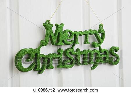 Merry Christmas sign hanging on door View Large Photo Image Stock Image - Merry Christmas sign hanging on door. Fotosearch