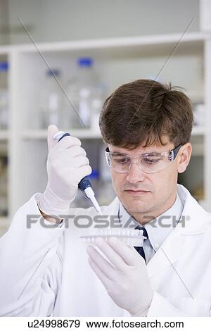 Mid adult scientist View Large Photo Image Stock Photo - Mid adult scientist. Fotosearch
