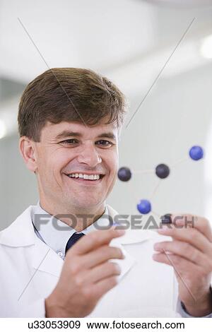 Mid adult scientist View Large Photo Image Stock Photo - Mid adult scientist. Fotosearch
