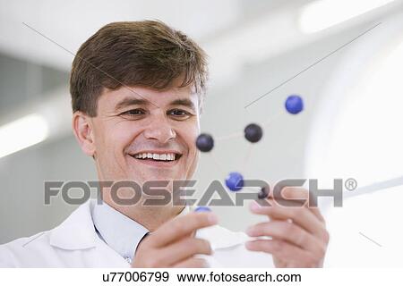Stock Photo - Mid adult scientist. Fotosearch