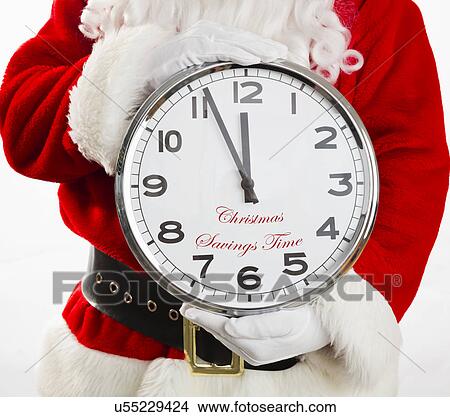 Mid section of Santa holding big wall clock View Large Photo Image Picture - Mid section of Santa holding big wall clock. Fotosearch