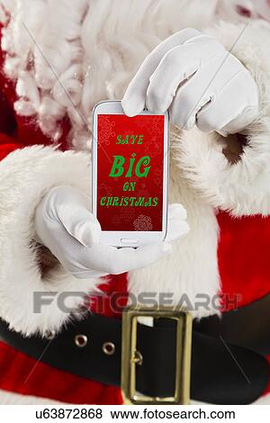 Mid section of Santa holding cell phone View Large Photo Image Stock Photo - Mid section of Santa holding cell phone. Fotosearch