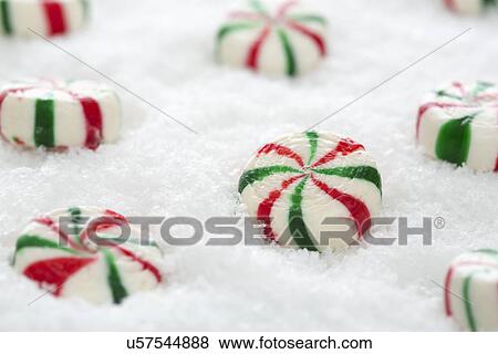 Mint candies in snow View Large Photo Image Stock Photo - Mint candies in snow. Fotosearch