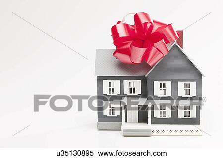 Model house with red ribbon View Large Photo Image Stock Photography - Model house with red ribbon. Fotosearch