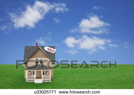 Model house with sold sign on grass View Large Photo Image Stock Image - Model house with sold sign on grass. Fotosearch