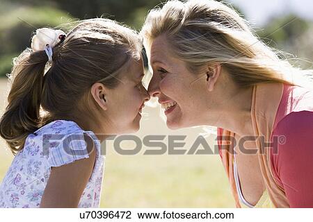 Mother and daughter (8-9) face to face View Large Photo Image Stock Image - Mother and daughter (8-9) face to face. Fotosearch