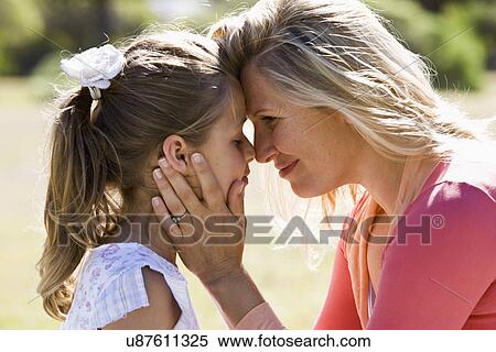 Mother and daughter (8-9) face to face View Large Photo Image Stock Photography - Mother and daughter (8-9) face to face. Fotosearch