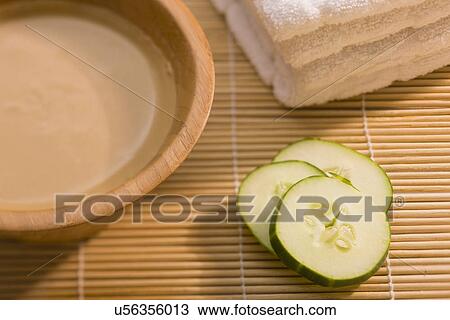 Mud mask and slices of cucumber on bamboo mat View Large Photo Image Stock Image - Mud mask and slices of cucumber on bamboo mat. Fotosearch