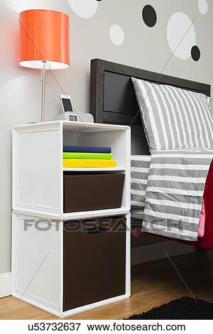Night table next to bed in dorm room View Large Photo Image Stock Photo - Night table next to bed in dorm room. Fotosearch