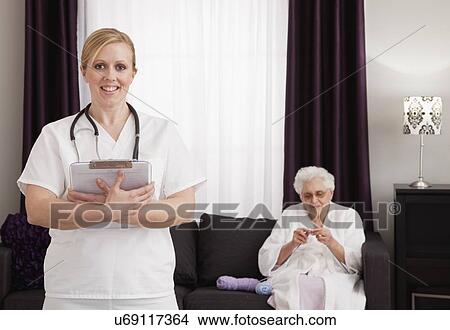 Nurse and patient in retirement home View Large Photo Image Picture - Nurse and patient in retirement home. Fotosearch