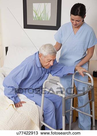 Nurse helping a senior patient View Large Photo Image Stock Image - Nurse helping a senior patient. Fotosearch