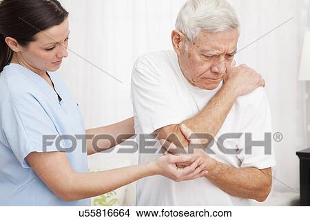 Nurse helping patient View Large Photo Image Picture - Nurse helping patient. Fotosearch