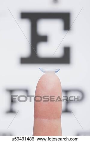 Palm with contact lens, eye chart in background, studio shot View Large Photo Image Stock Photograph - Palm with contact lens, eye chart in background, studio shot. Fotosearch